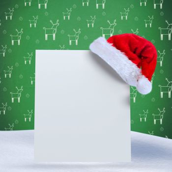 Santa hat on poster against green reindeer pattern