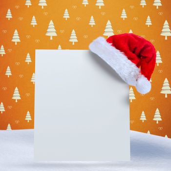 Santa hat on poster against orange tree pattern