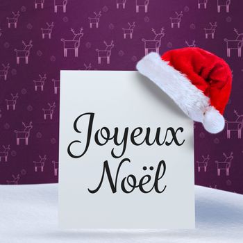 Joyeux noel against purple reindeer pattern