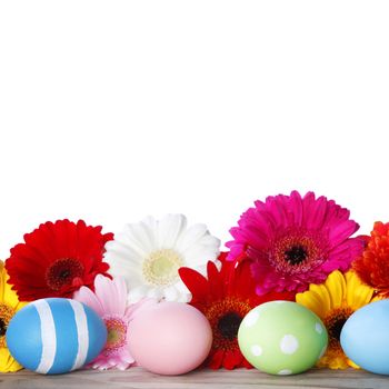 Beautiful painted easter eggs and flowers isolated on white background