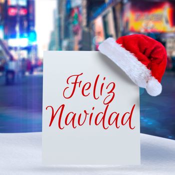 Feliz navidad against blurry new york street