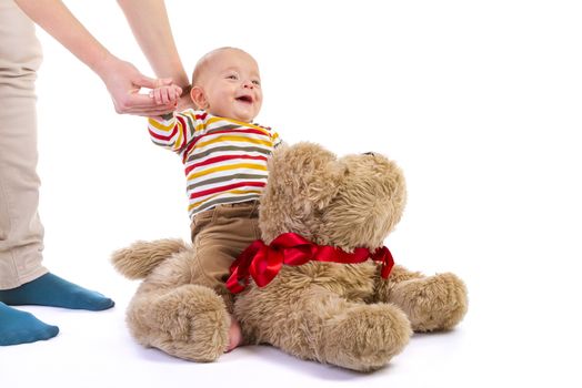 baby boy over plush dog on white background