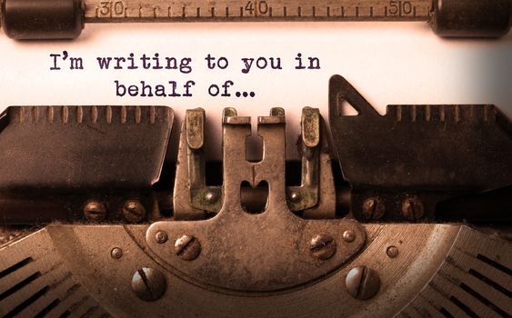 Vintage inscription made by old typewriter, I'm writing to you in behalf of