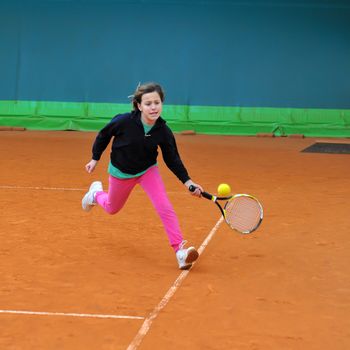 Children at school during a dribble of tennis