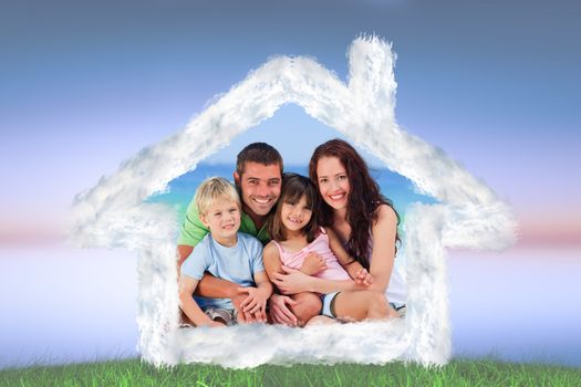 Portrait of a family at the beach against green grass under blue and purple sky