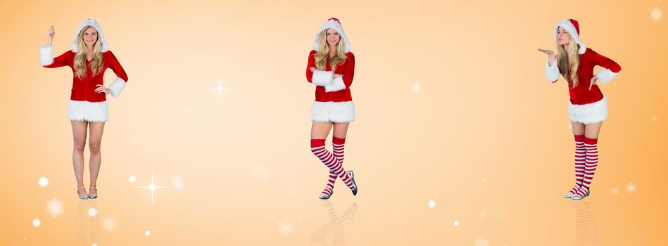 Pretty girl in santa outfit holding hand up against orange vignette