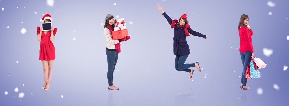 Festive brunette holding gift bags against purple vignette