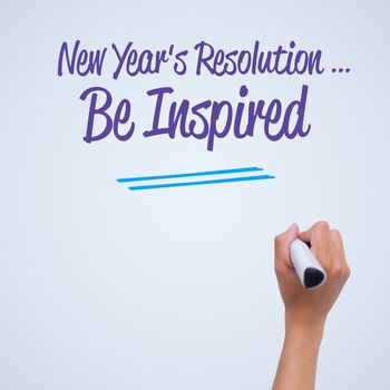 new years resolution against female hand writing with marker