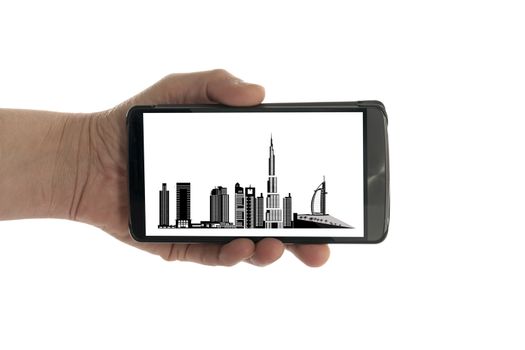 female hand with mobile phone isolated on white with dubai skyline
