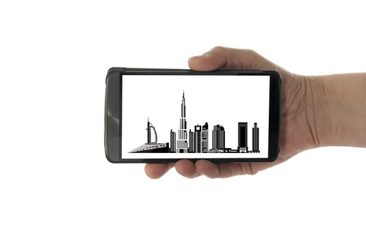 female hand with mobile phone isolated on white with dubai skyline