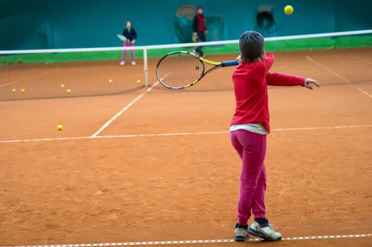 Children at school during a dribble of tennis