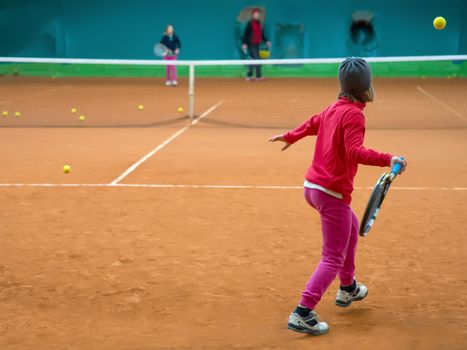 Children at school during a dribble of tennis