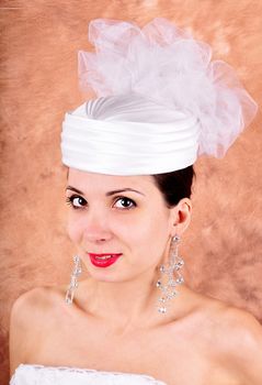 young girl in a wedding dress and hat