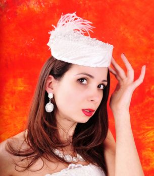 young girl in a wedding dress and hat