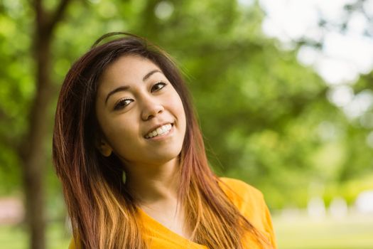 Close up portrait of beautiful young woman outdoors