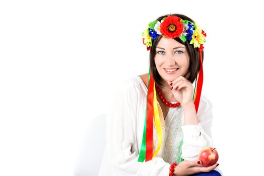 beautiful young brunette woman wearing national ukrainian clothes posing in studio on white background