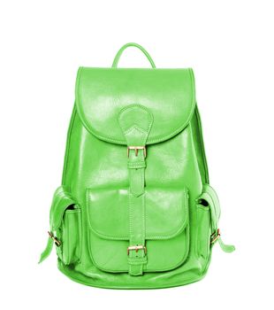 Green leather backpack standing isolated on white background