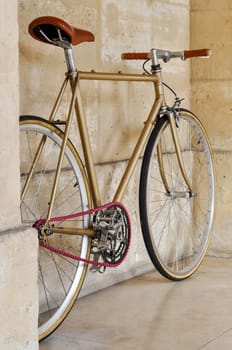 Vintage fixie bicycle with a pink chain