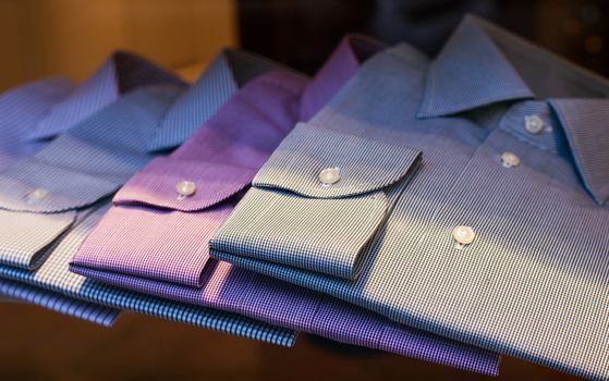 Close up of male shirts exposed in the clothes shop