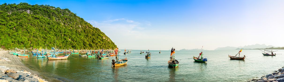 group of fishing boat anchored at Pranburi beach in Thailand