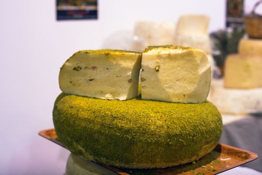 Sicilian cheese dressed with pistachio nuts grind