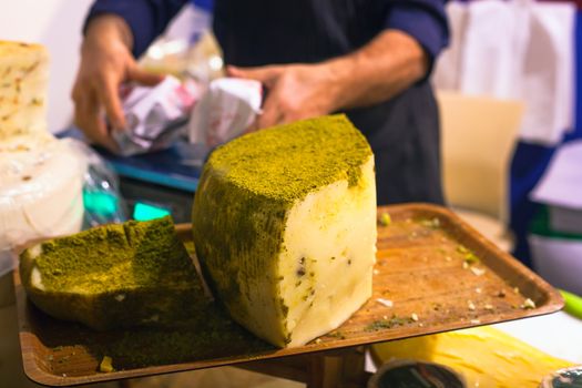 Sicilian cheese dressed with pistachio nuts grind