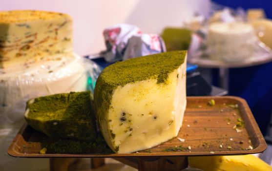 Sicilian cheese dressed with pistachio nuts grind