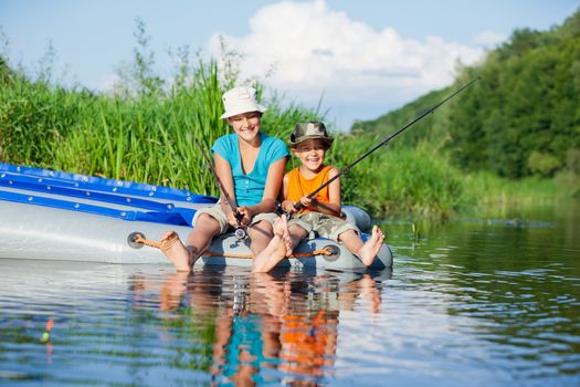 Summer vacation - Sister and brother fishing at the river