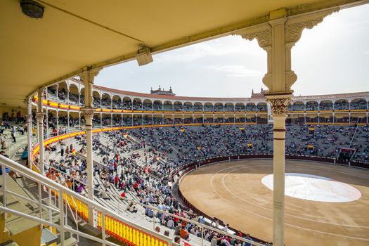 Madrid, Spain - May 11, 2012: Plaza de Toros de Las Ventas interior view with tourists gathering for the bull show in Madrid on a sunny day, Spain