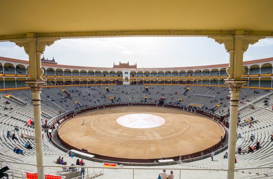 Madrid, Spain - May 11, 2012: Plaza de Toros de Las Ventas interior view with tourists gathering for the bull show in Madrid on a sunny day, Spain