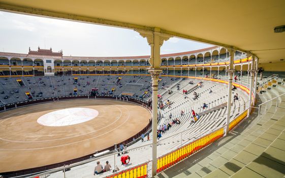 Madrid, Spain - May 11, 2012: Plaza de Toros de Las Ventas interior view with tourists gathering for the bull show in Madrid on a sunny day, Spain