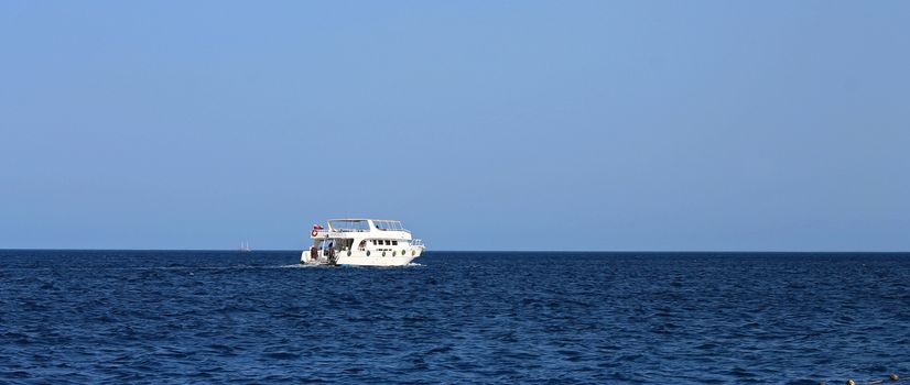 White Ship Moving By The Red Sea