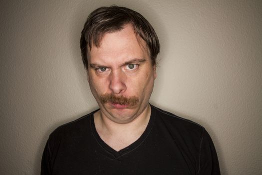 funny looking guy is not impressed with what he is looking at