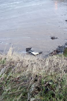 storm damaged danger sign on Ballybunion beach in county Kerry Ireland