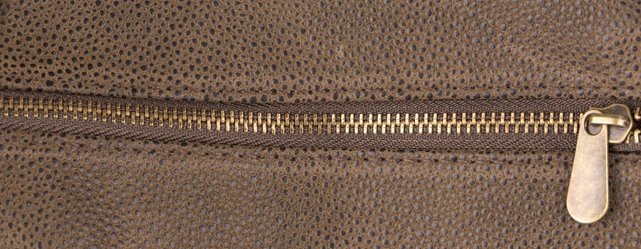 Brown leather texture and zipper background 
