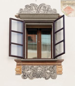 Window of old house in Ljubljana, Slovenia, with murals