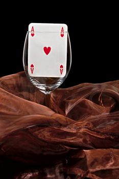 ace of hearts in a glass