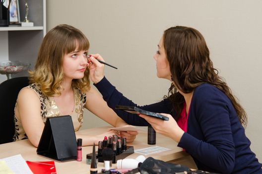 Beauty Consultants offers cosmetics client in the office