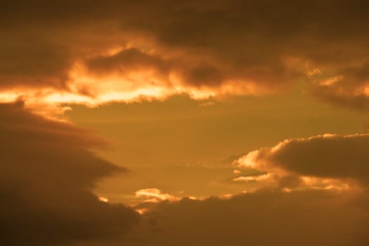 beautiful cloudy orange sunset sky in the wild Atlantic way, Ireland with sunbeams