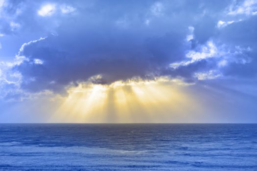 sun rays streaming through the storm clouds on the Irish wild Atlantic way