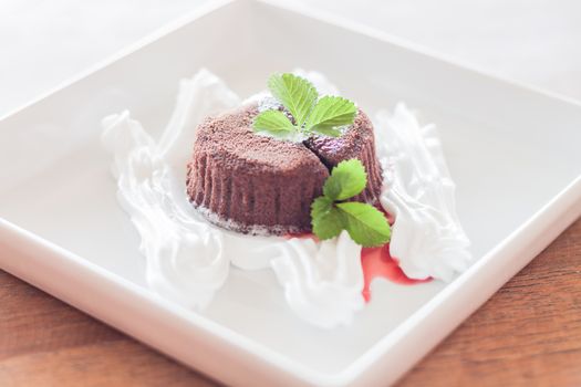 Chocolate lava with whipped cream, stock photo