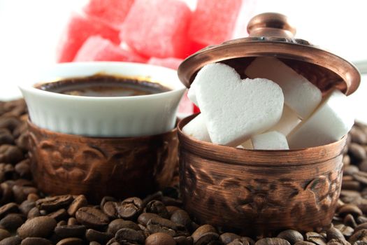 Coffee with heart shaped sugar and locum