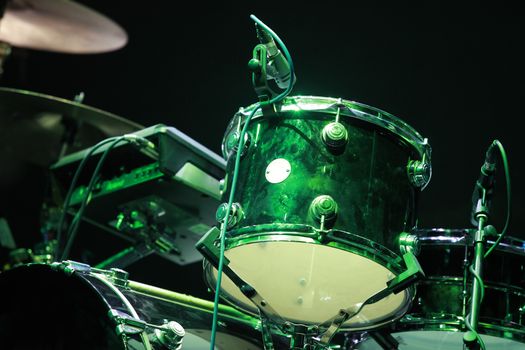 Drums on stage with on black background