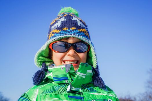 Winter, play, fun - Portrait of cute little boy having fun in winter park