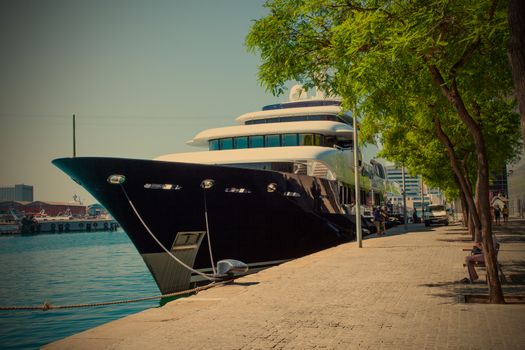 Moll d'Espanya, Barcelona, Spain, JUNE 13, 2013, Black Yacht Martha Ann in the seaport, Editorial use only, instagram image style