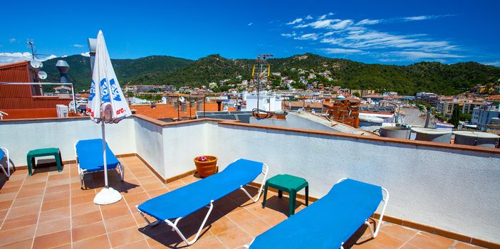 Solarium on the roof of the hotel in the town of Tossa de Mar, Costa Brava, Catalonia, Spain, 2013.06.20, Editorial use only
