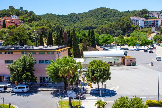 Spain, Catalonia, Tossa de Mar, 20-06-2013, landscape with the bus station and the memorial cemetery of the town, editorial use only