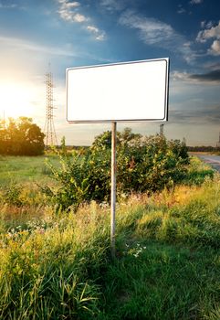 Billboard in a field near the road