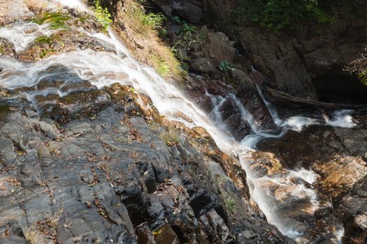 Cliff waterfall. River that flows down from the cliff. The water that flows down from the top of the mountain.