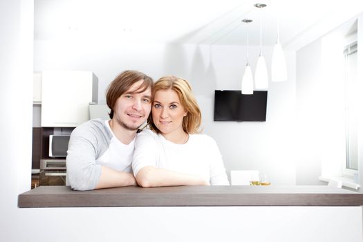 Smiiling Couple Relaxing In New Home